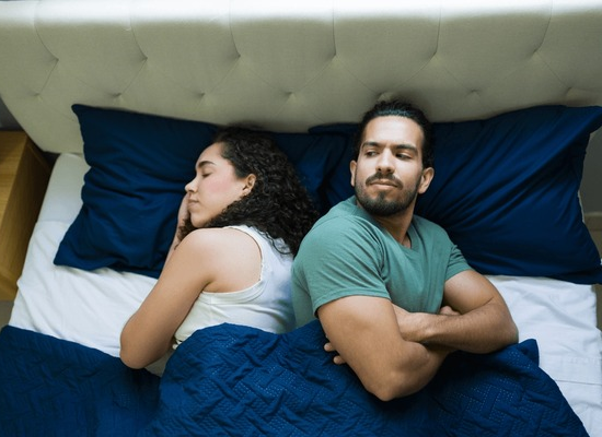 angry-hispanic-couple-lying-back-600nw-2669556501